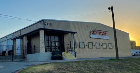 Dallas Trailer Repair building at dusk